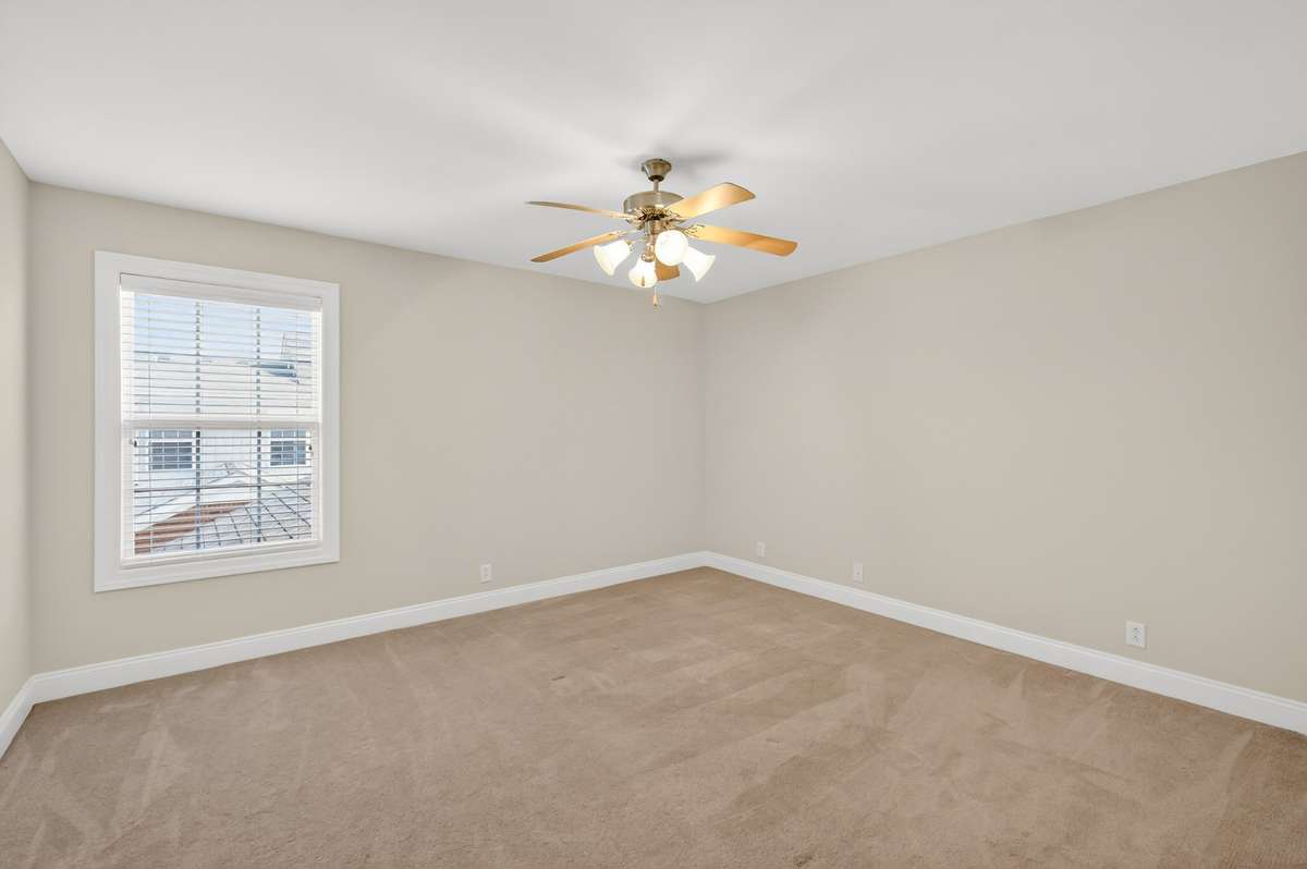 Bedroom 2 Upstairs has ceiling fan, large closet and has been freshly painted.