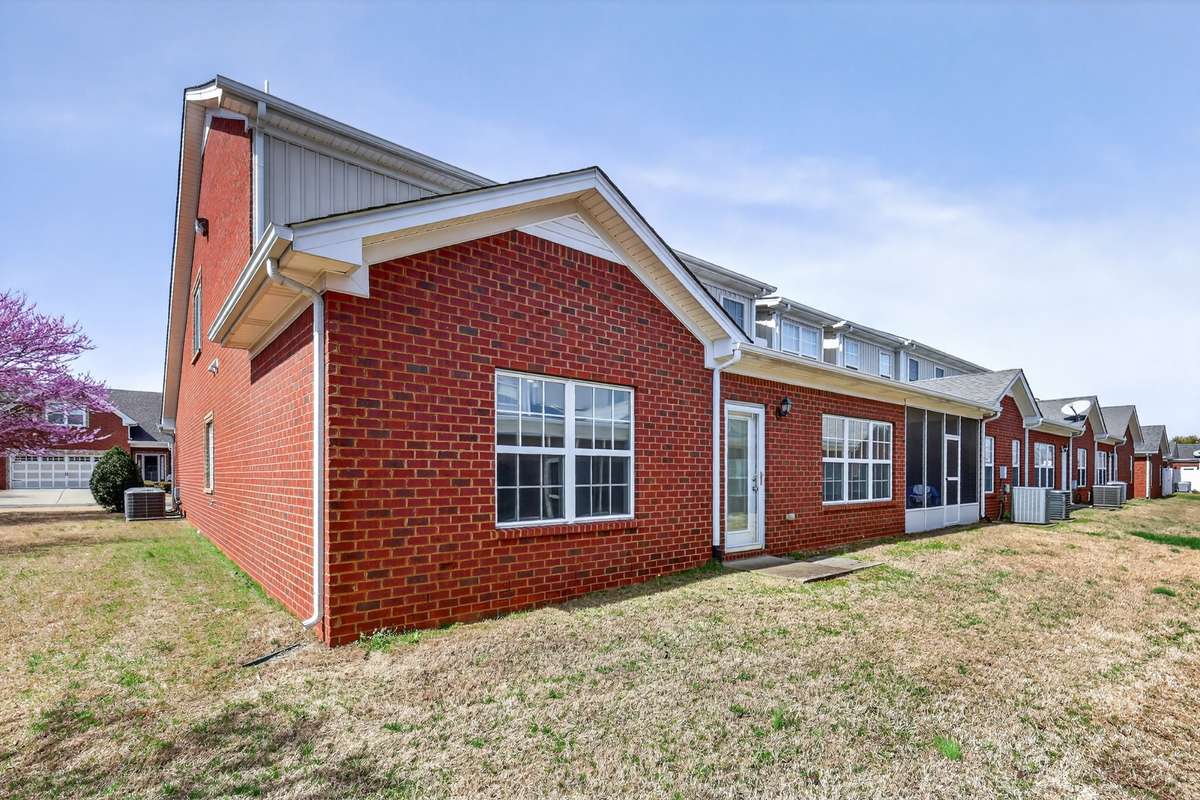 Classic Brick home located on a corner lot. Easy access to common area and extra parking.