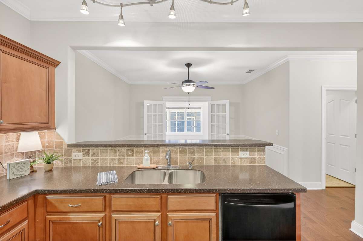 View into the Dining Area from the Kitchen. Pantry in to your right.