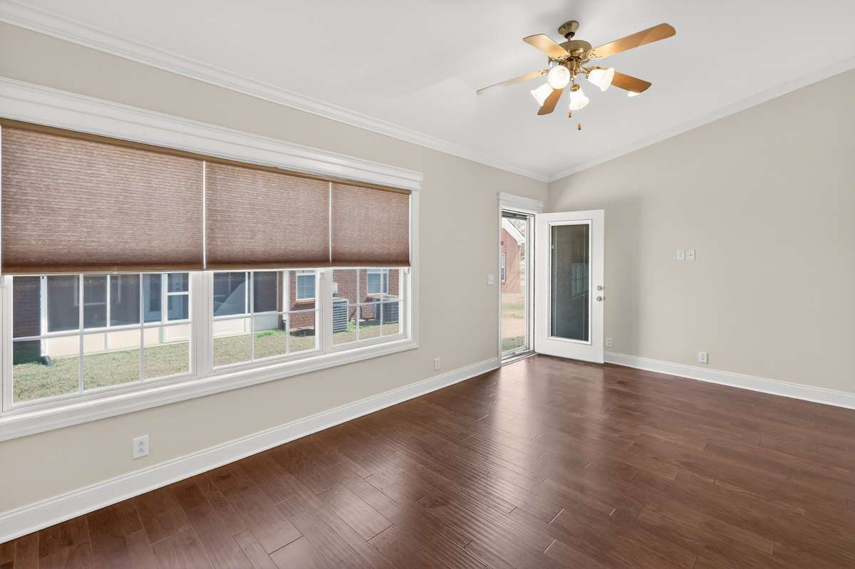 Door has blinds built-in for privacy. There is also a storm door that leads to the backyard.