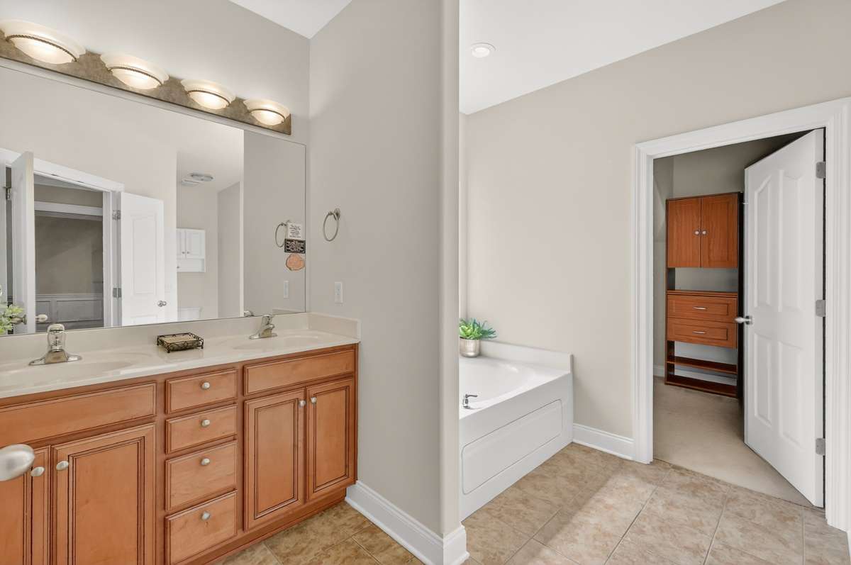 Primary Bathroom with Double Sinks and ample cabinets and drawers for storage.