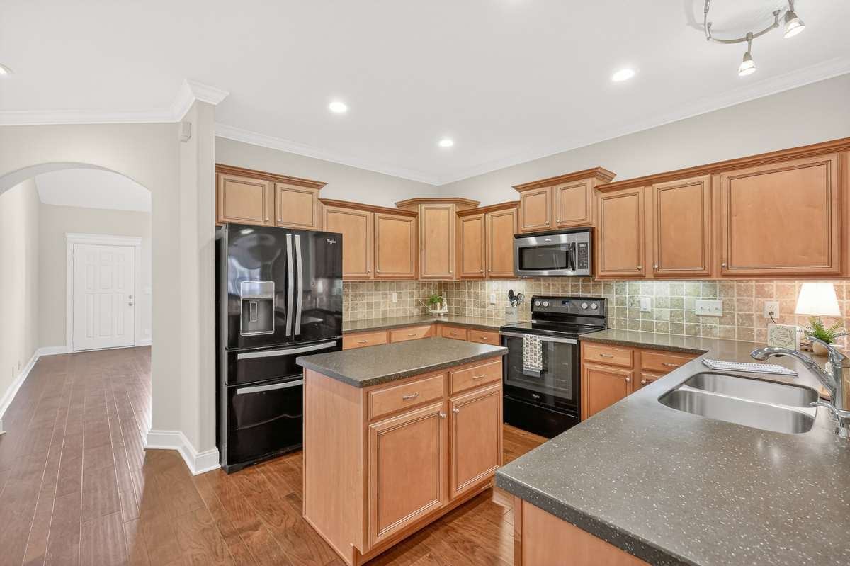 Pretty Tile Backsplash and Solid Surface Counters.