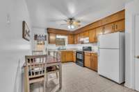 Just beyond the living room is the eat-in kitchen with a pantry.