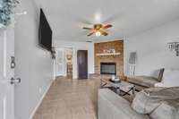 Just inside you'll find a large living room with wood burning fireplace.