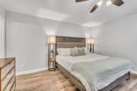 Featuring laminate flooring and a ceiling fan.