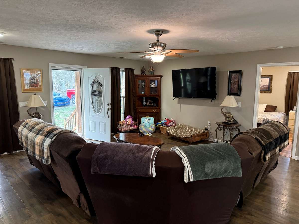 Living Room- LVP flooring, ceiling fan, recessed lighting