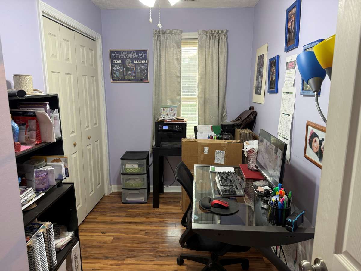 Bedroom- currently used as an office, ceiling fan, laminate flooring
