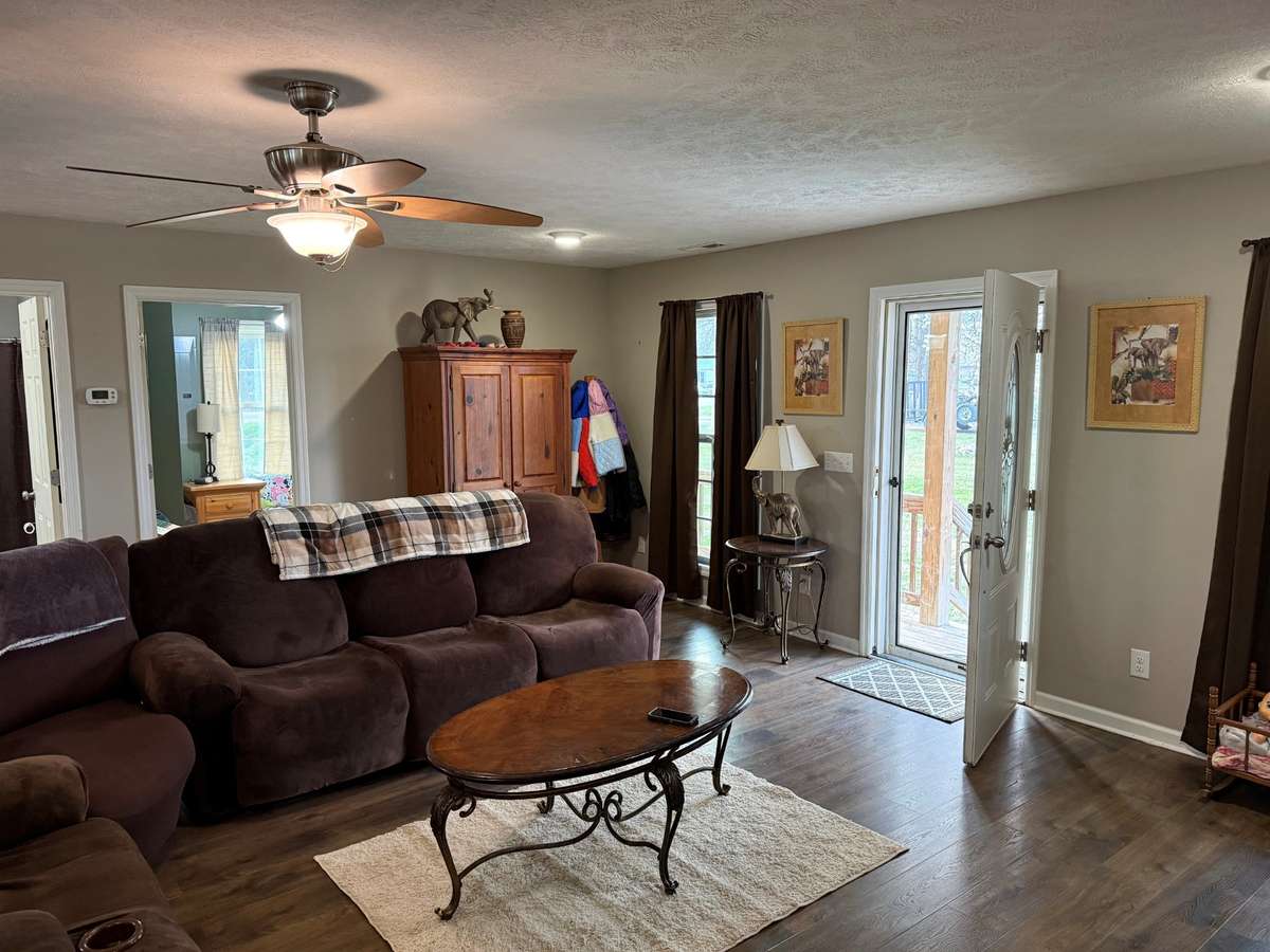 Living Room- LVP flooring, recessed lighting, ceiling fan