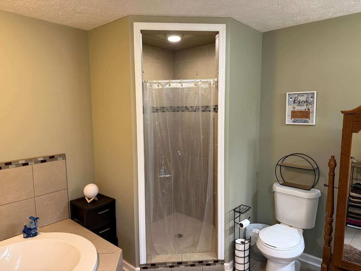 Full bath- separate tub and shower, jacuzzi, double vanities, tile shower