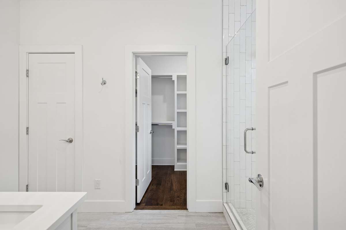 Primary Bathroom leading to Primary Closet