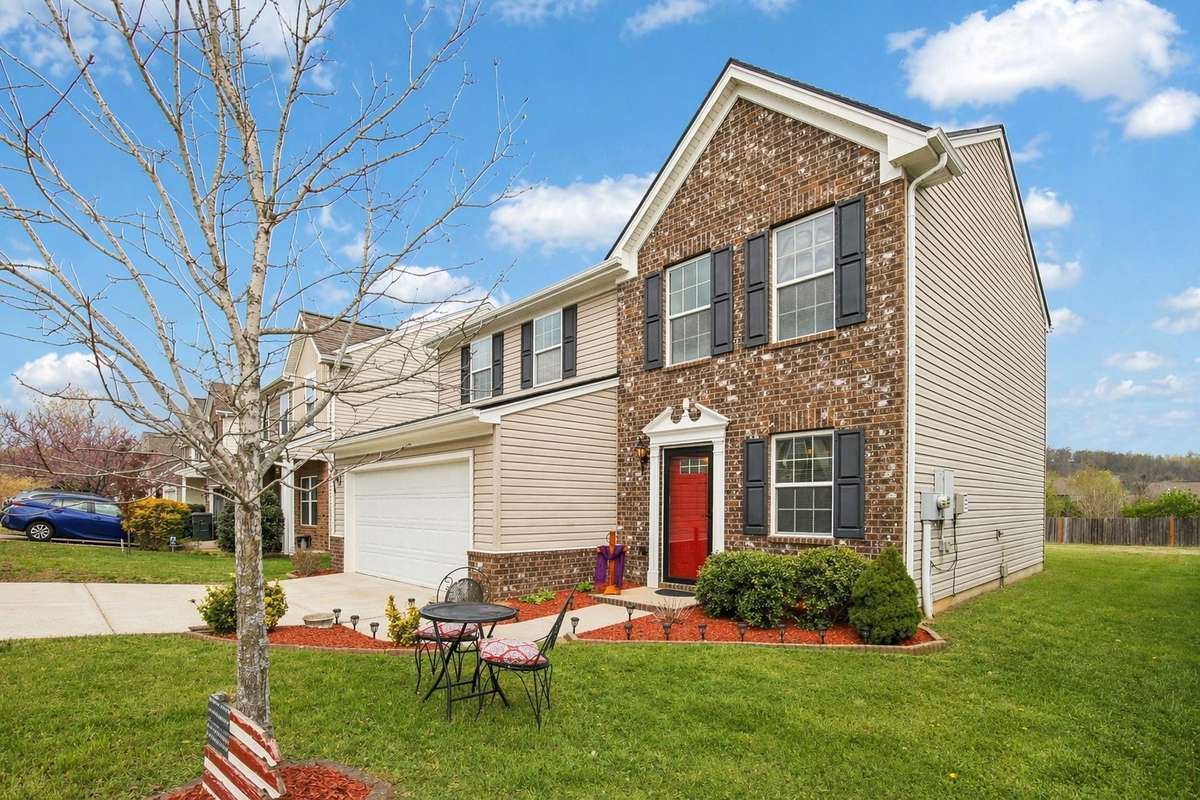 Inviting curb appeal continues with a welcoming front yard space, perfect for morning coffee or evening unwinding.