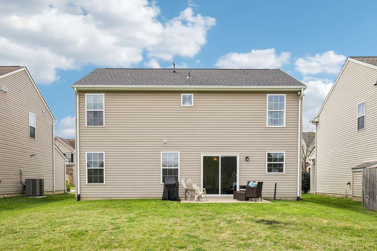 Spacious backyard with a private patio and plenty of room to relax, entertain, or enjoy outdoor living. Ideal setup for gatherings, grilling, or everyday enjoyment.