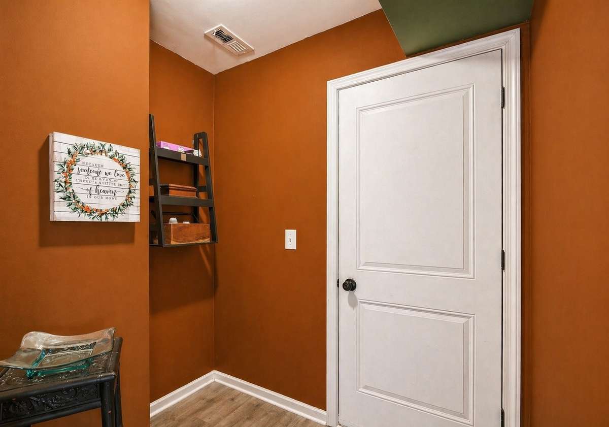 Convenient mudroom located just off the garage, offering a functional drop zone with space for coats, shoes, and everyday organization.