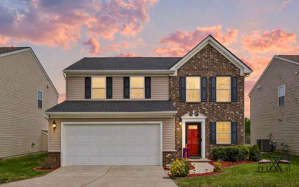 Welcome to this one-owner home, 1268 Scarcroft Ln. Inviting front exterior featuring soft evening lighting, landscaped entry, and welcoming curb appeal.