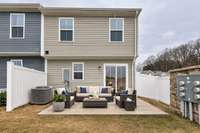Virtually staged patio offering privacy of an end unit