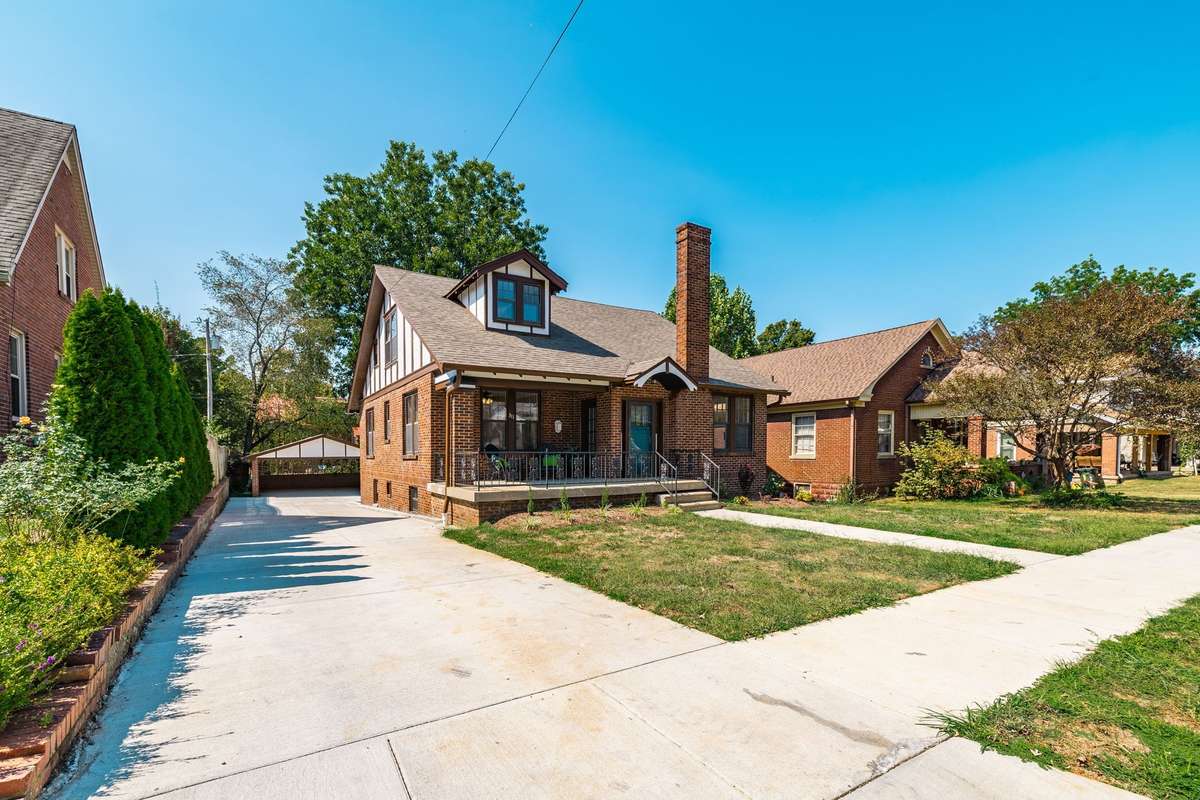 This home features a beautiful new concrete driveway leading to the private parking area and detached carport, providing convenience and curb appeal.