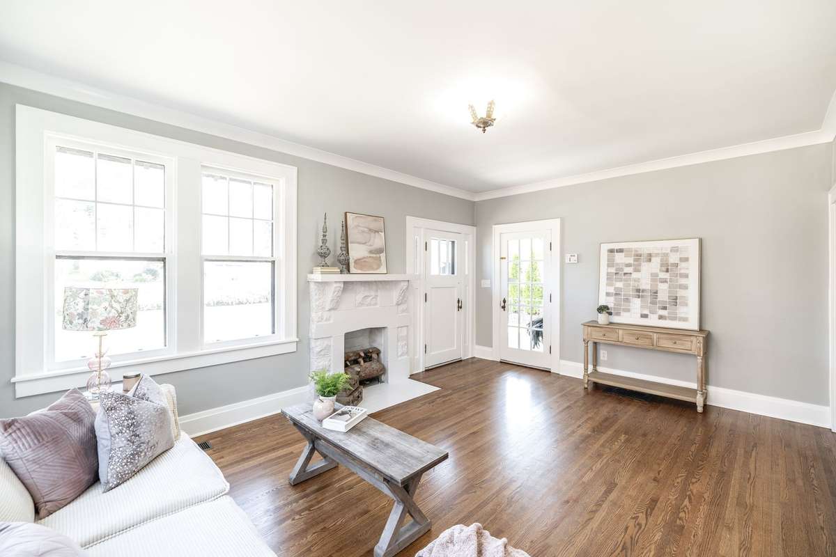 Large windows allow sunshine to pour in, highlighting the perfect blend of historic charm and modern updates.