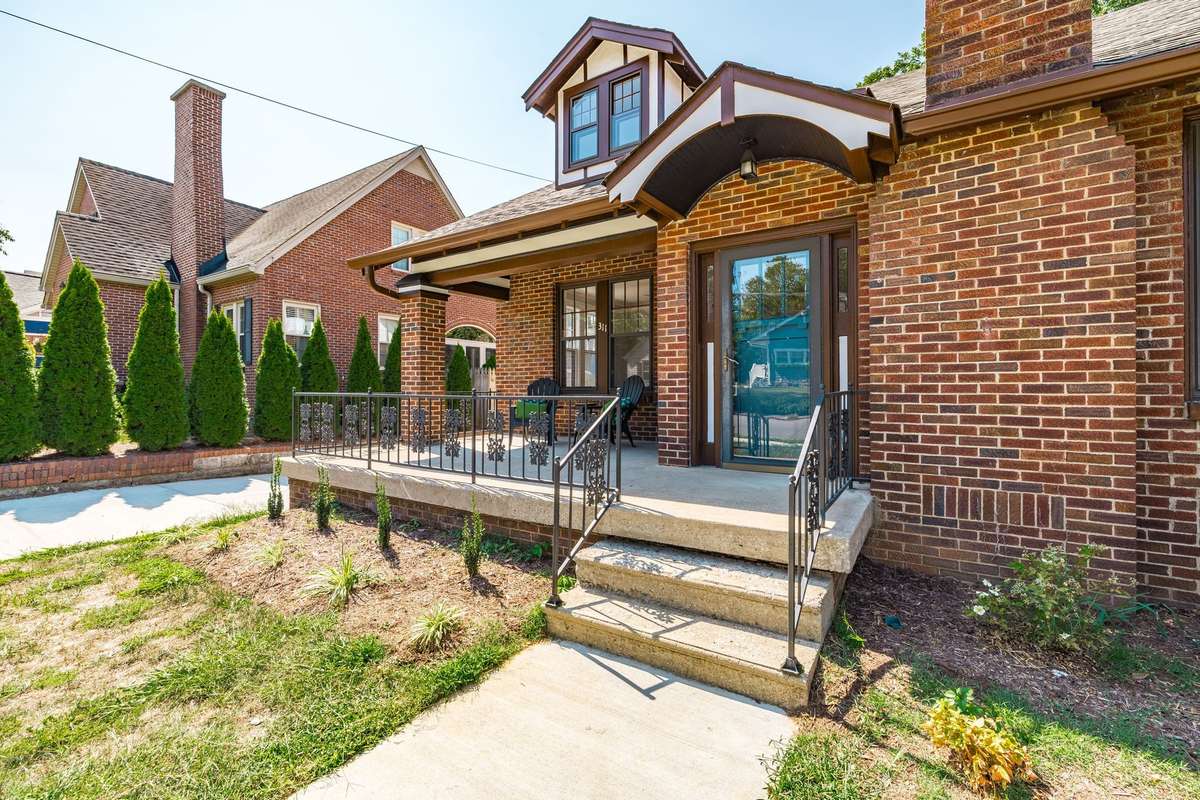 A full view of the home’s brick façade, highlighting its timeless architecture paired with tasteful modern updates.