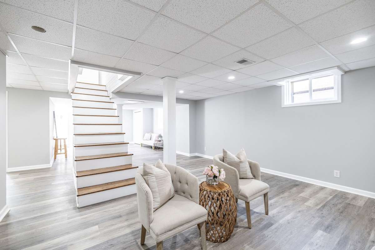 Spacious finished basement offering the perfect setting for a recreation room, complete with fresh flooring and ample natural light.