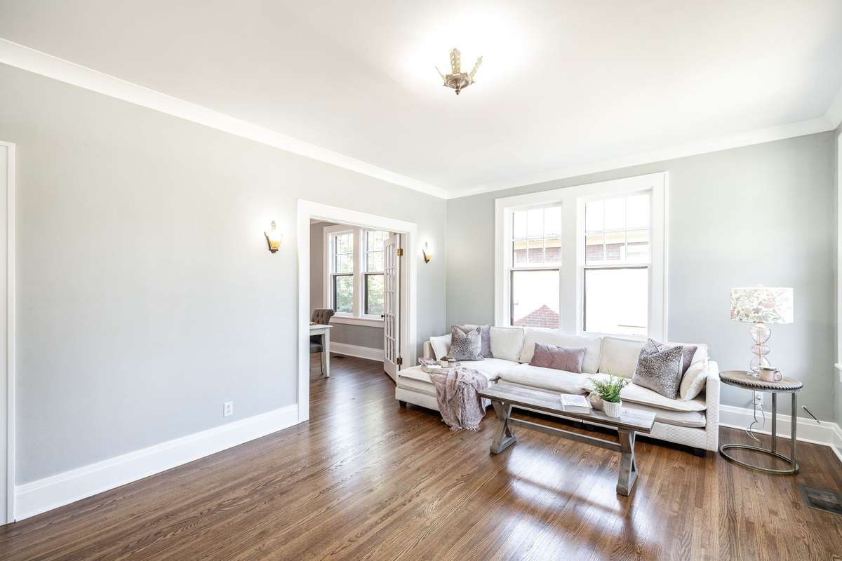 Cozy yet open layout offers the perfect setting for gatherings, with the fireplace adding a touch of historic elegance.