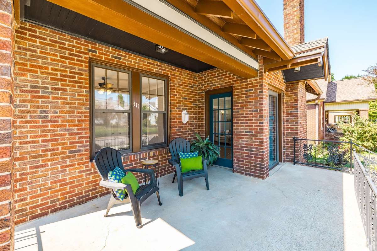 Welcome to 311 Walnut Street! The spacious porch with room for seating invites you to relax and enjoy the neighborhood charm.