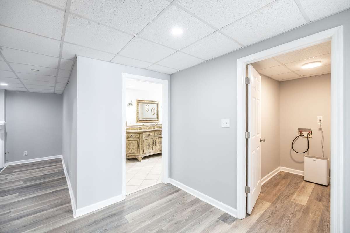 Full bath on the basement level offers added convenience, making this area a functional extension of the home.