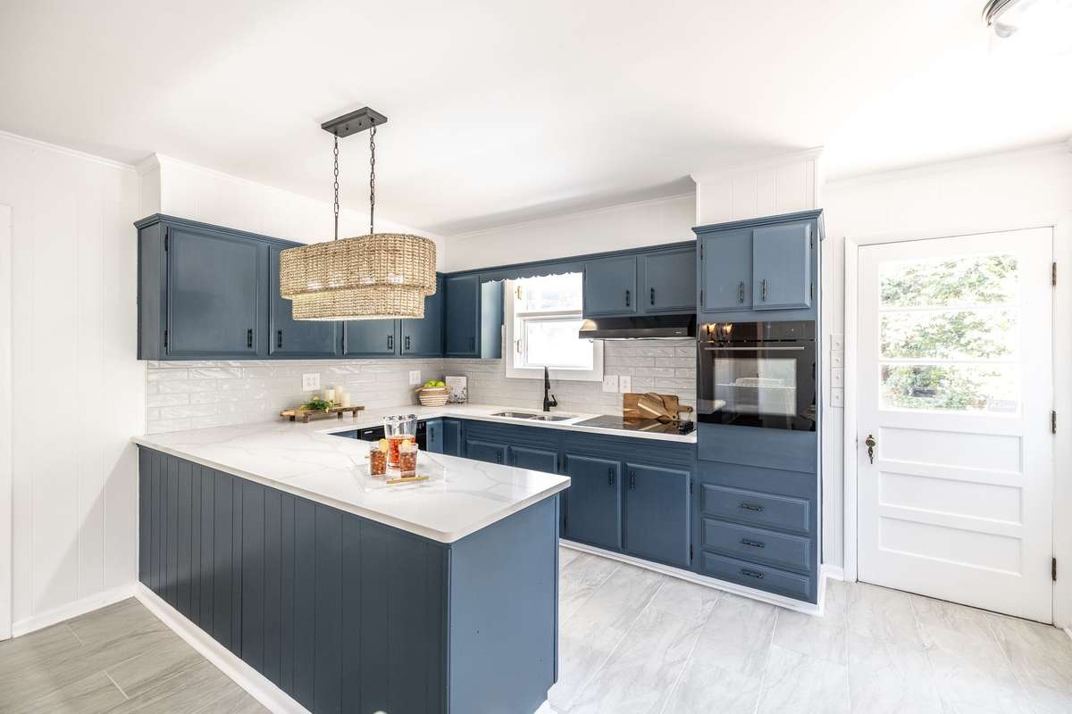 A view of the kitchen’s functional layout featuring and counter space for prep work