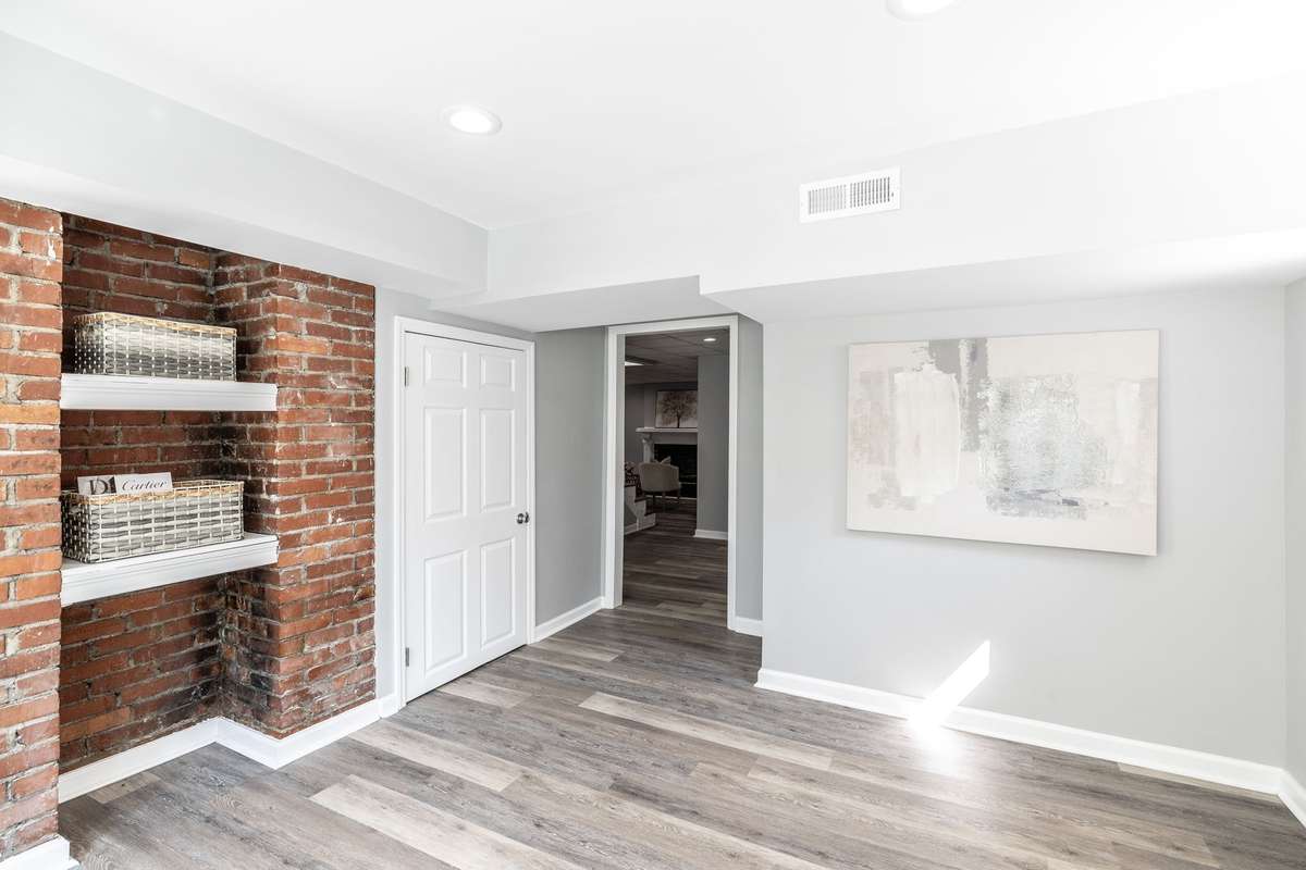 Character-filled basement featuring stunning exposed original brick, blending historic charm with modern updates.