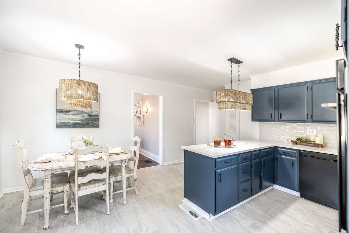 Updated light fixtures add a fresh touch while maintaining the character of this historic home’s kitchen