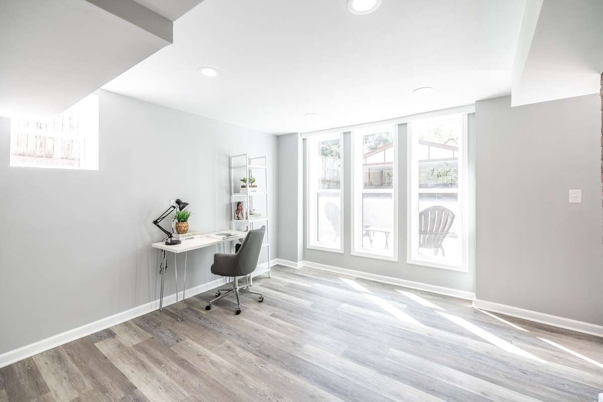 Bright and inviting office space in the basement, providing a quiet and productive area away from the main living areas
