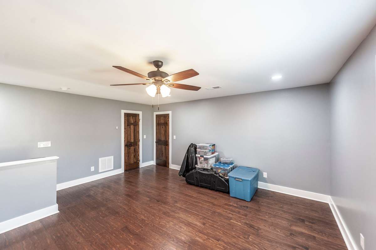 The hardwood floors add warmth and character, creating a polished space that complements any design style.