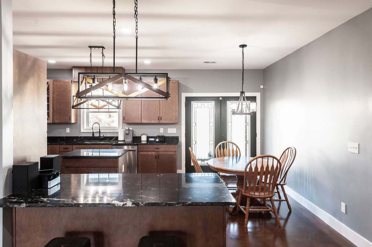 Stained cabinets and granite counters give the kitchen a warm, welcoming feel while providing plenty of prep and storage space.