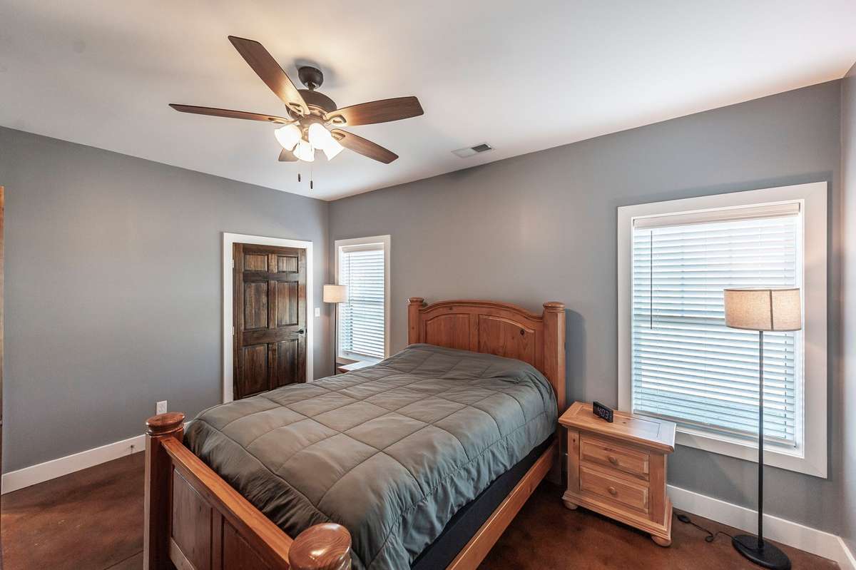 The spacious primary suite offers a peaceful retreat with plenty of natural light and room to relax.