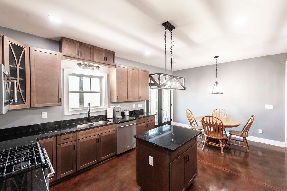 The bright dining space within the kitchen offers a comfortable spot for casual meals with views of the backyard.