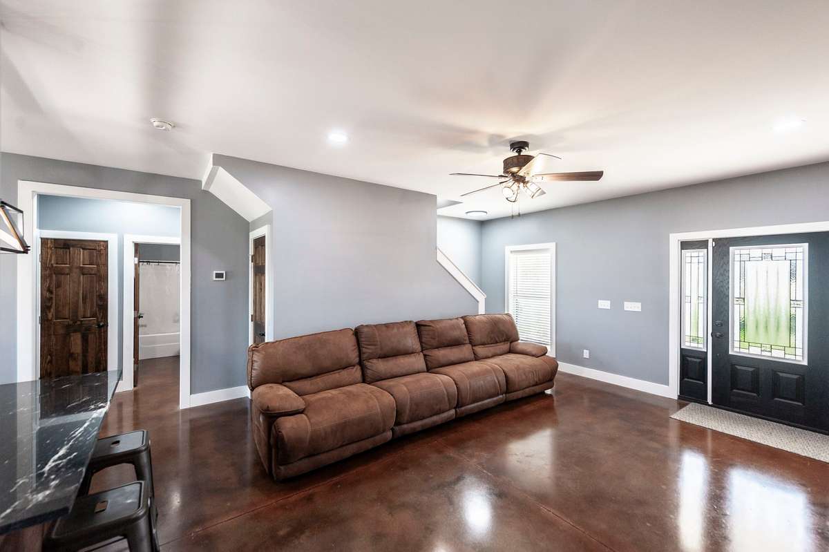With its comfortable layout and inviting fireplace, the living room is the perfect place to gather with family and friends.