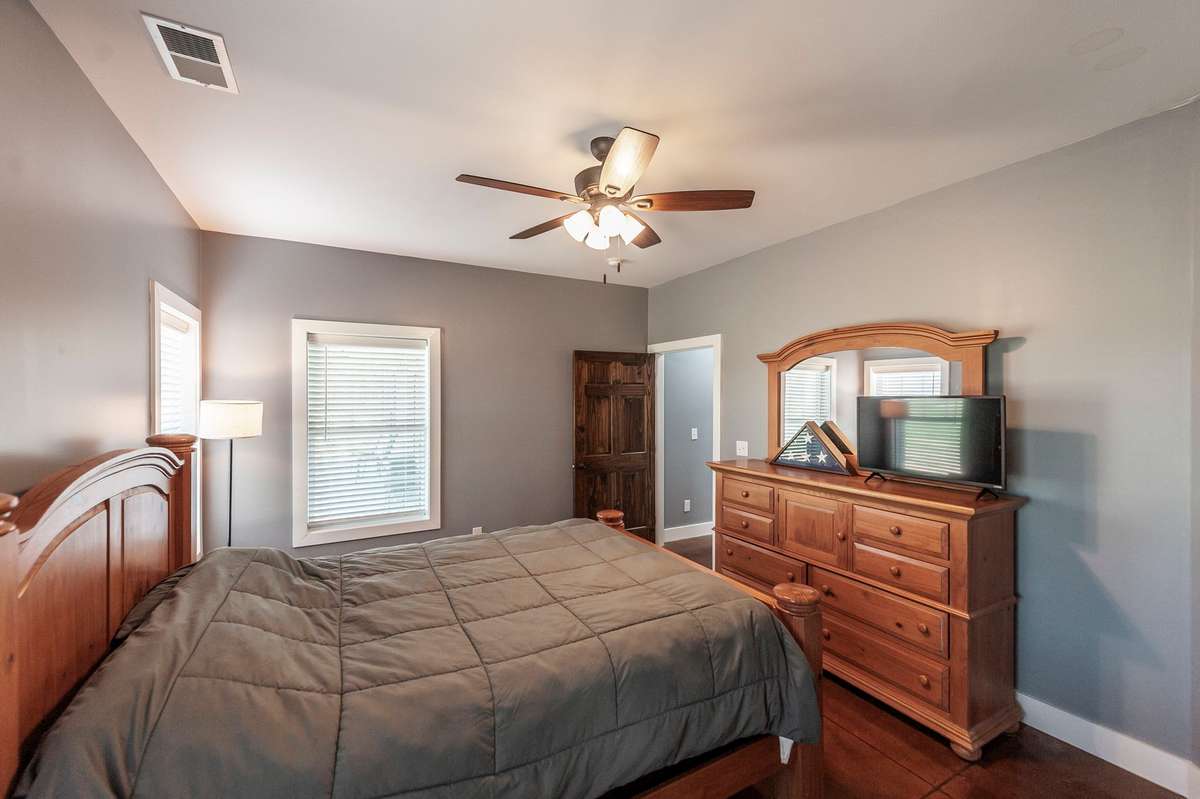 With generous space and thoughtful layout, the primary suite provides both comfort and privacy for everyday living.