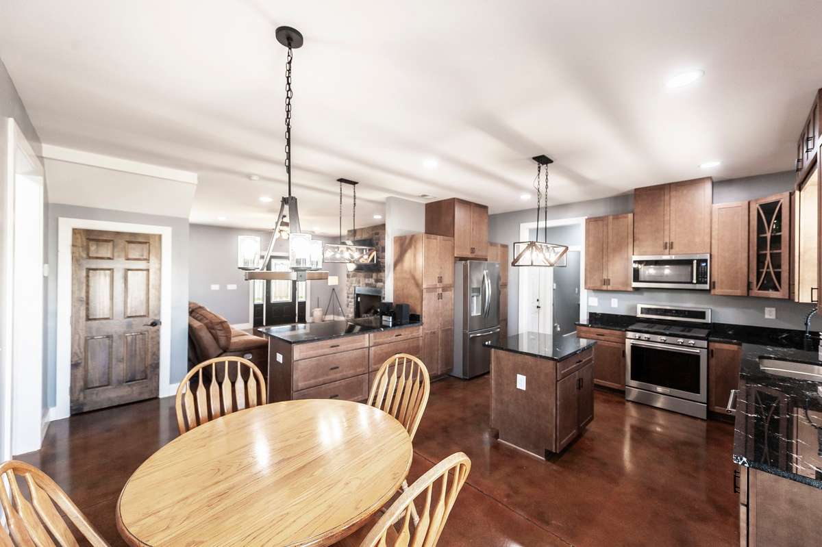 The kitchen flows seamlessly into the living area, creating an open and inviting space that is perfect for gathering and entertaining.