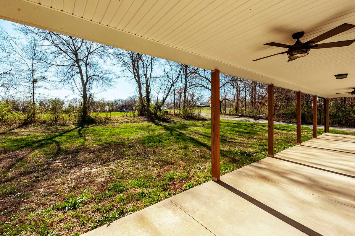 Tucked behind a natural tree line and set back from the road, the home offers a wonderful sense of privacy and a peaceful first impression.
