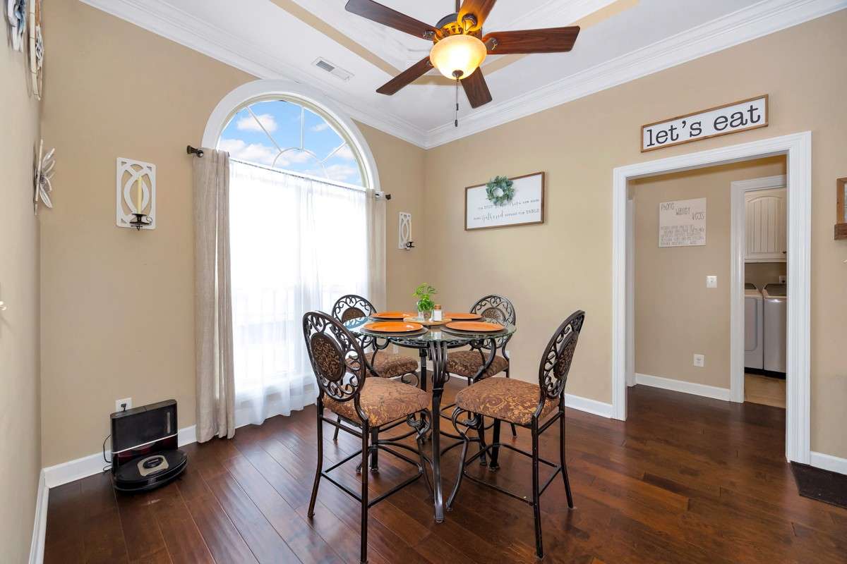 Breakfast Room- Wood flooring, crown molding, trey ceiling, ceiling fan, 10' ceiling