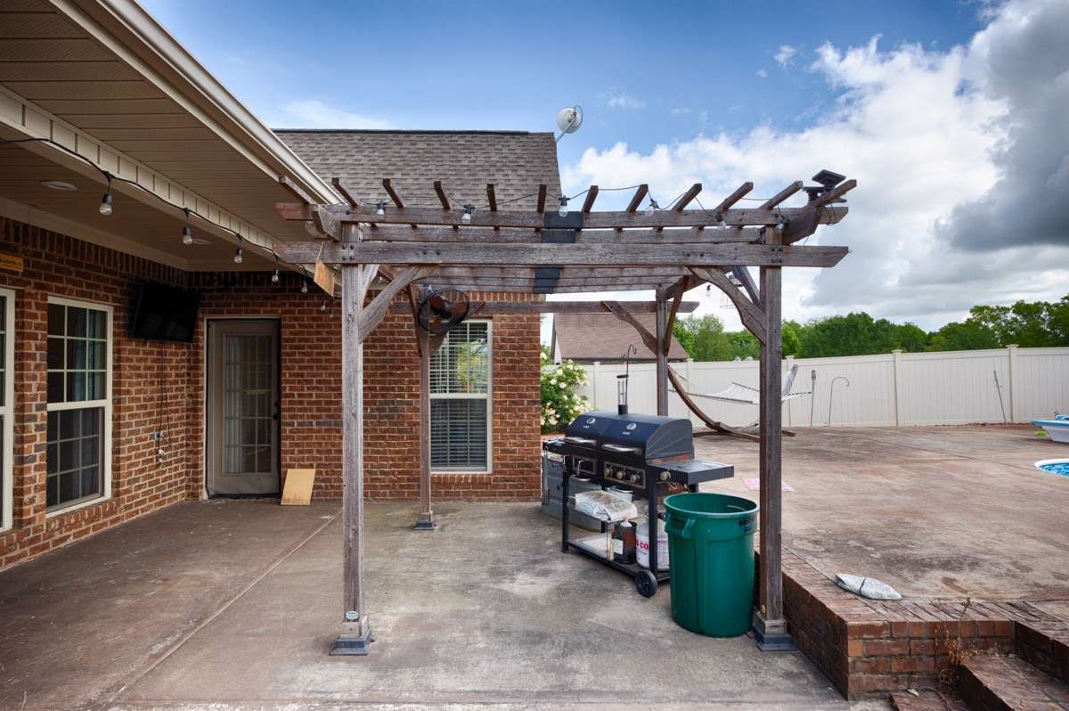 Covered porch- pergola area for grilling or entertaining poolside