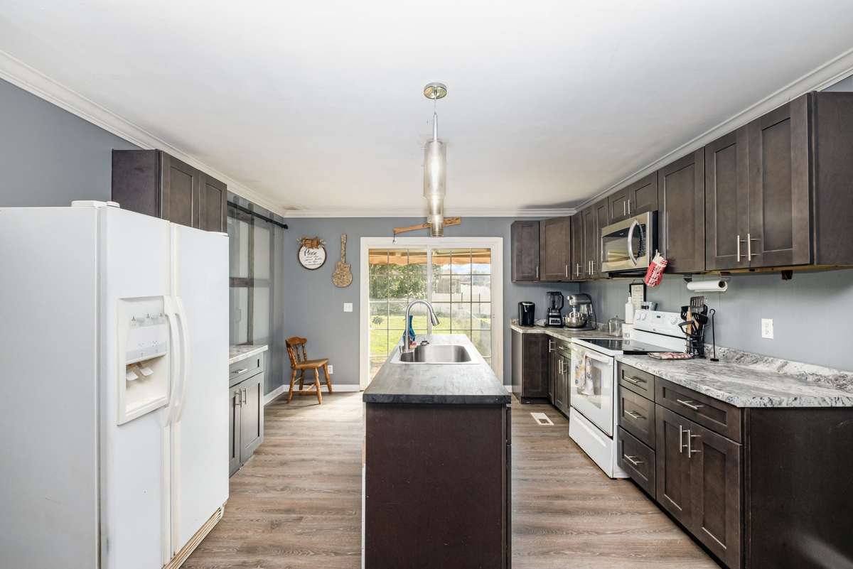 Kitchen with sliding door to backyard