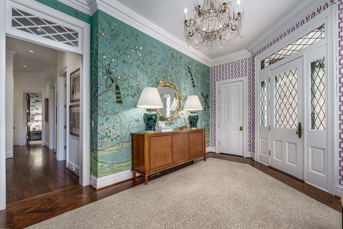 Exquisite  wallpaper and chandler welcome you to this spectacular home