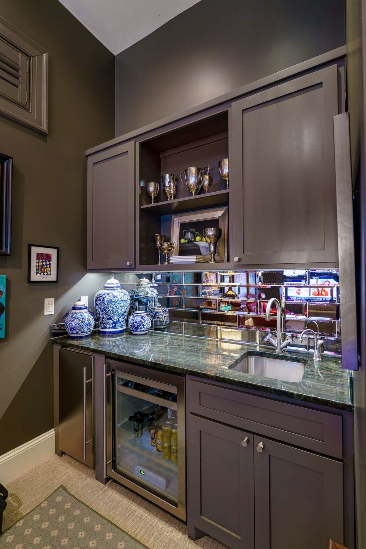 Wet bar in Media Room has a refridgerator