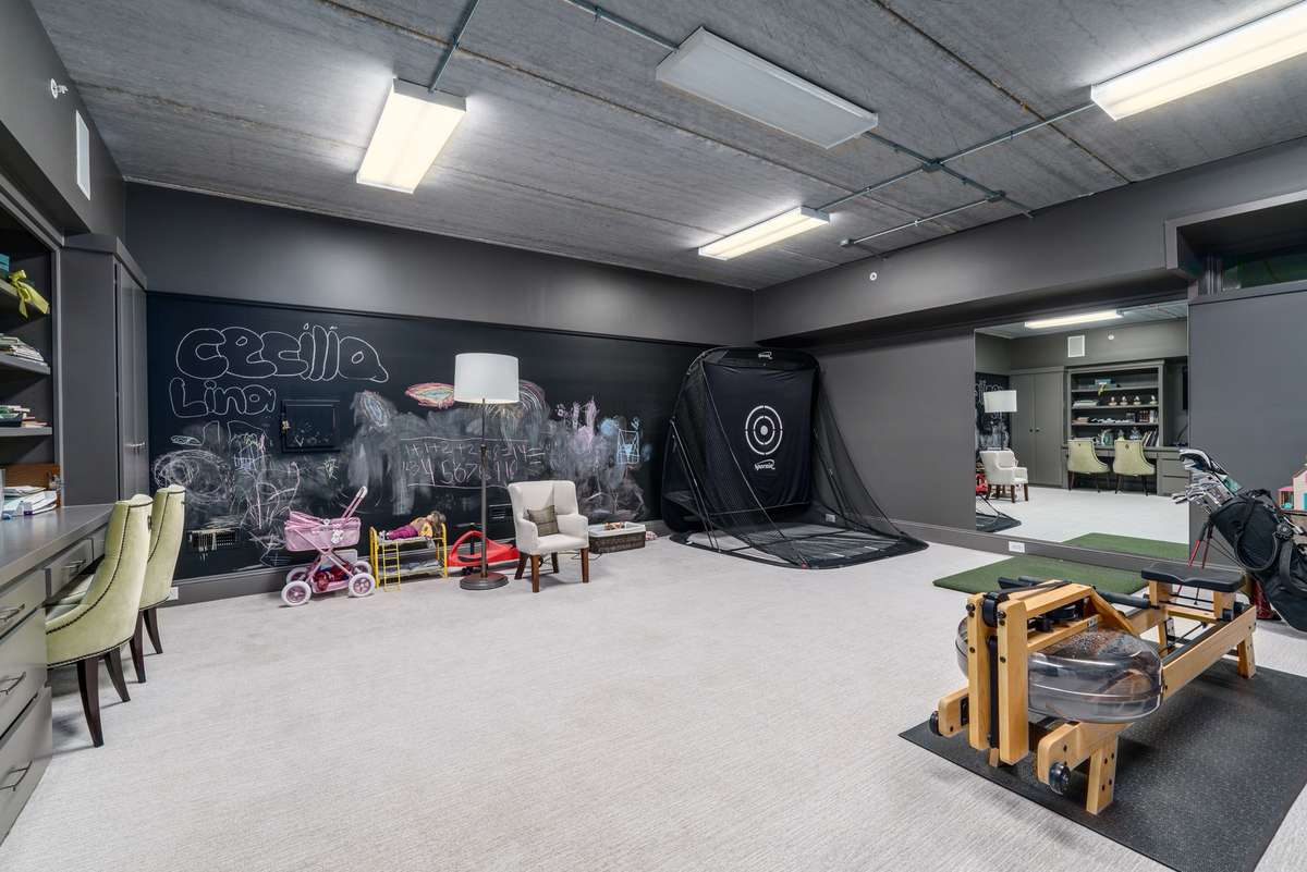 A rare find in the Brownstones - this exercise and playroom, Features built in cabinets and chalk wall.