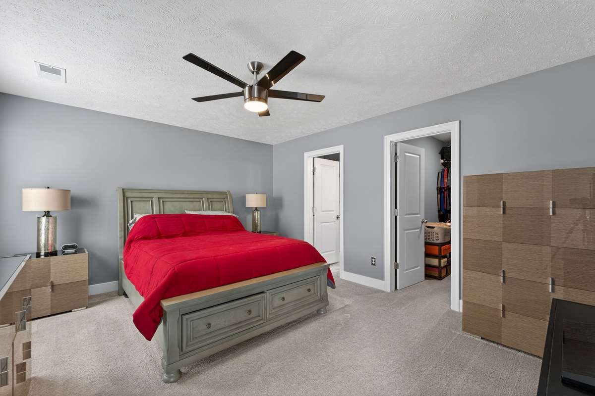 The primary bedroom includes a walk-in closet and ceiling fan to keep things comfortable year-round.