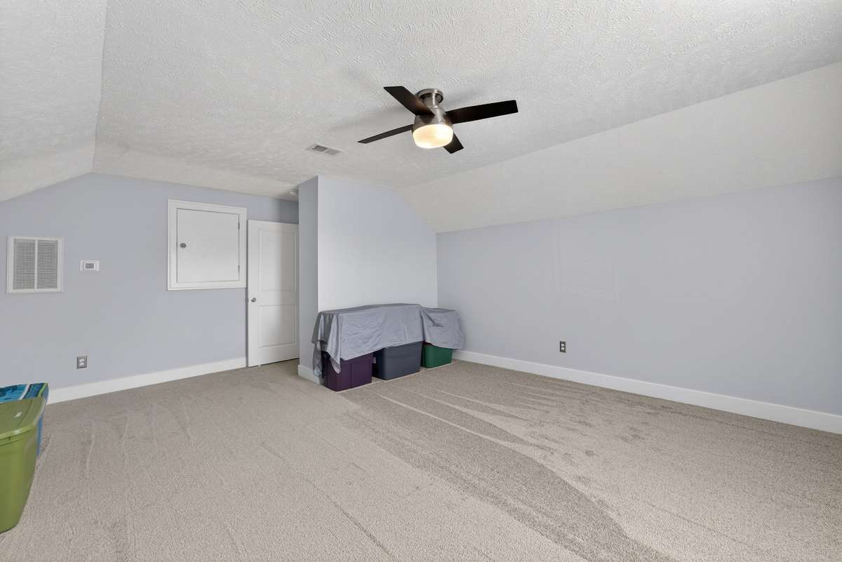 Ceiling fan and built-in access panel keep this upper-level retreat comfortable and functional for whatever you need the extra square footage to become.