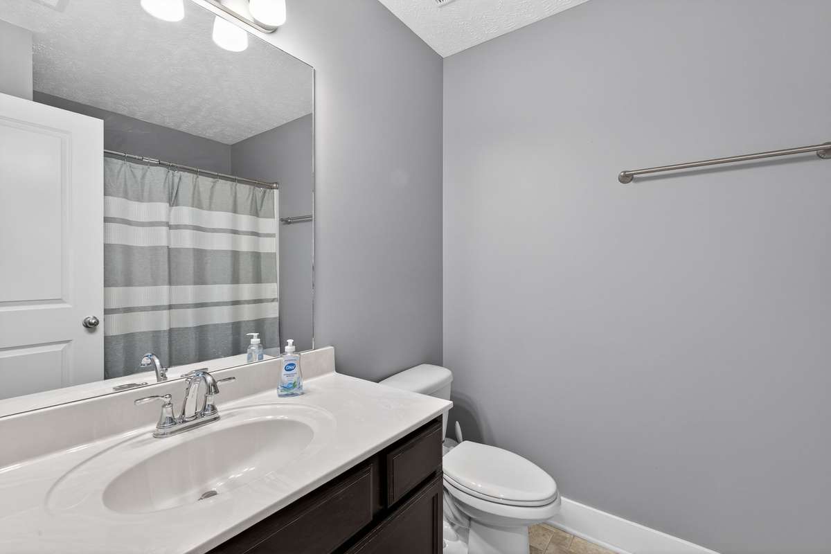 This hall bathroom is just the perfect size to accommodate both secondary bedrooms.