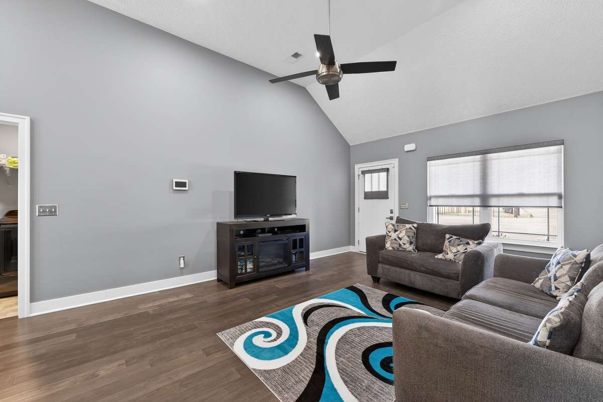 The sectional arrangement creates a natural conversation area with the television as the focal point, making evenings feel cozy without crowding the room.