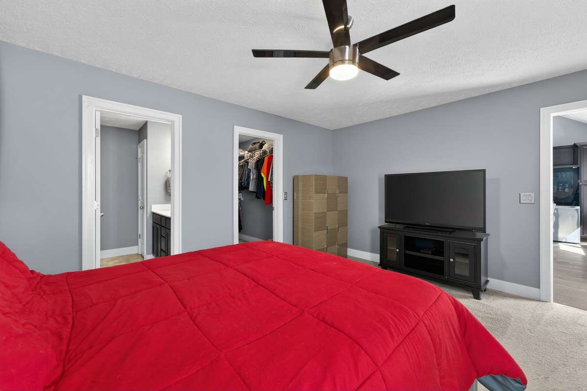 Primary bedroom includes direct access to the walk-in closet and ensuite bath.