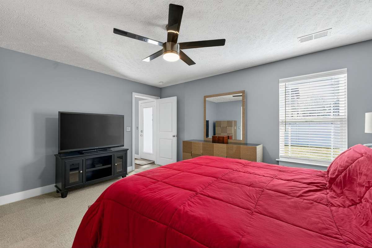 The large primary suite has plenty of room for your bed and furniture.